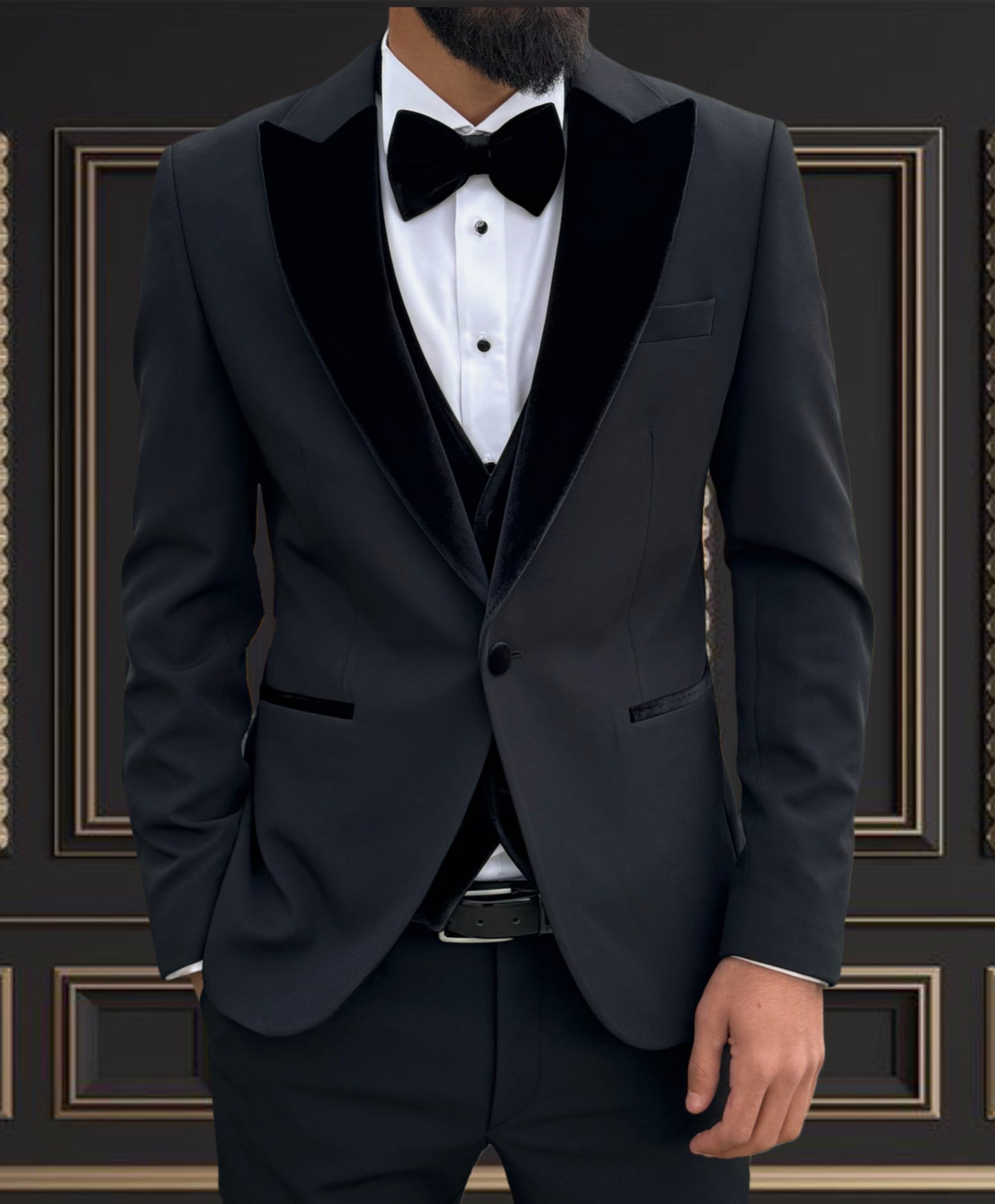 Men's black velvet peaked lapel tuxedo with bow tie, perfect for weddings and formal events.