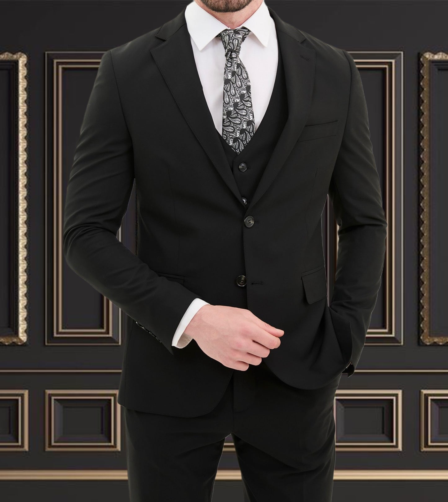 Men's black slim fit 3-piece suit with stylish tie and elegant backdrop, perfect for formal events.