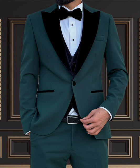 Men's emerald green tuxedo with velvet peak lapel, perfect for weddings and formal events.