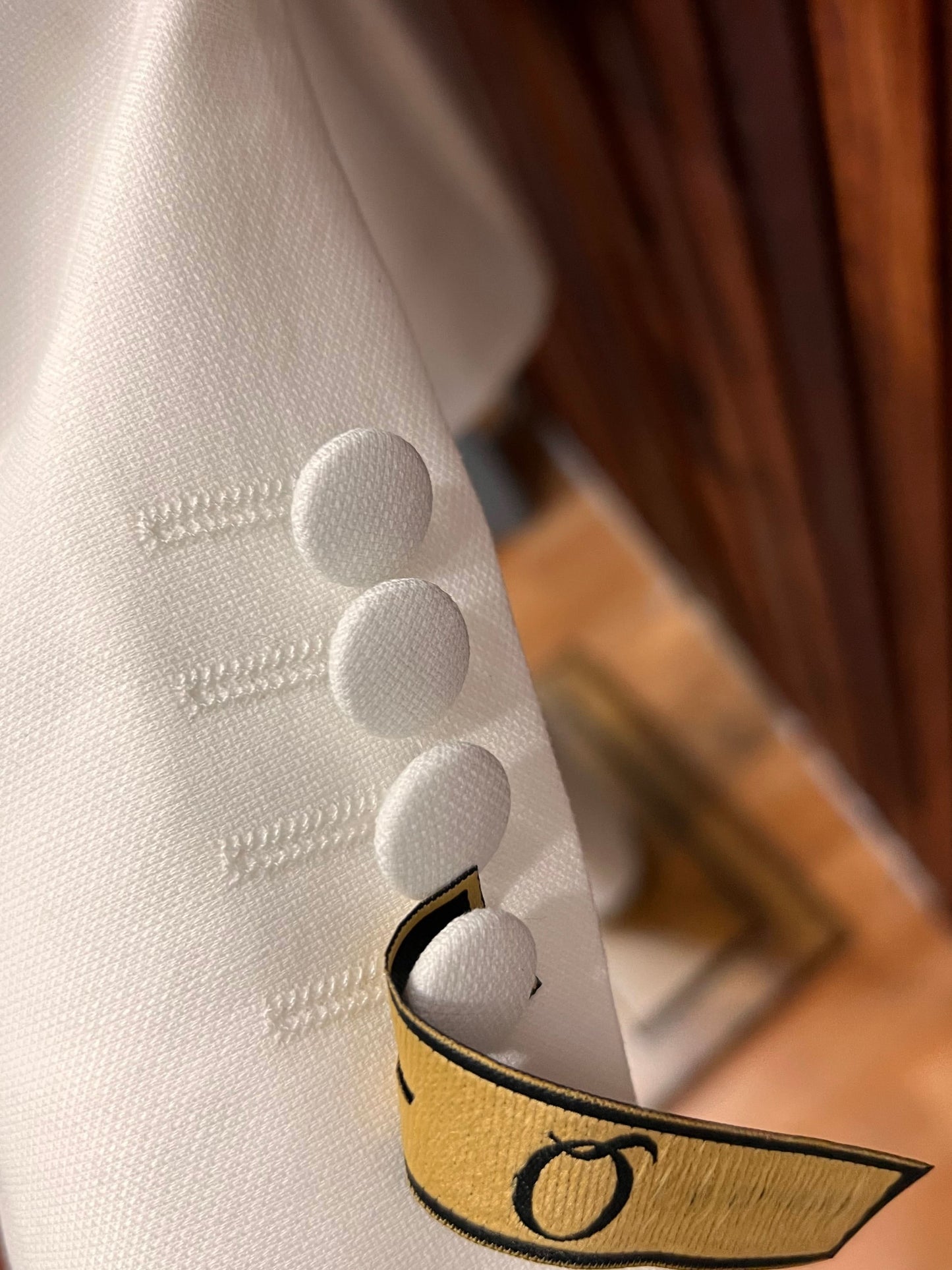 Close-up of buttons on Men’s Off-White Tuxedo showcasing elegant craftsmanship and sophisticated design.