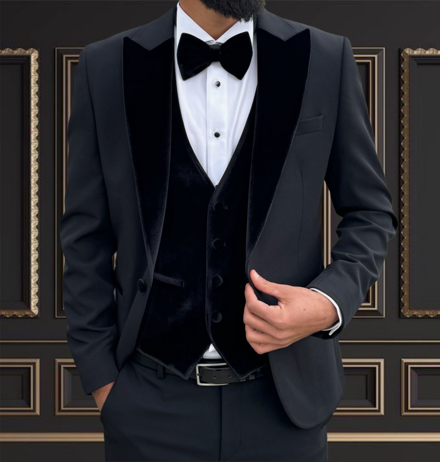 Men's black velvet peak lapel tuxedo with bow tie, ideal for weddings and formal events.